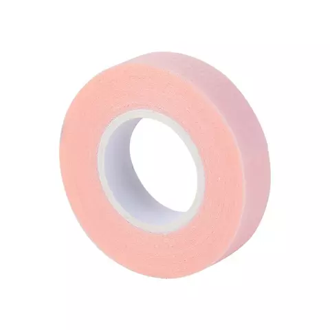 A roll of pink coloured Bee Pampered Lash Tape, ideal for securing and protecting lashes during extensions or treatments, with a sleek and professional design, displayed on a clean, neutral background.