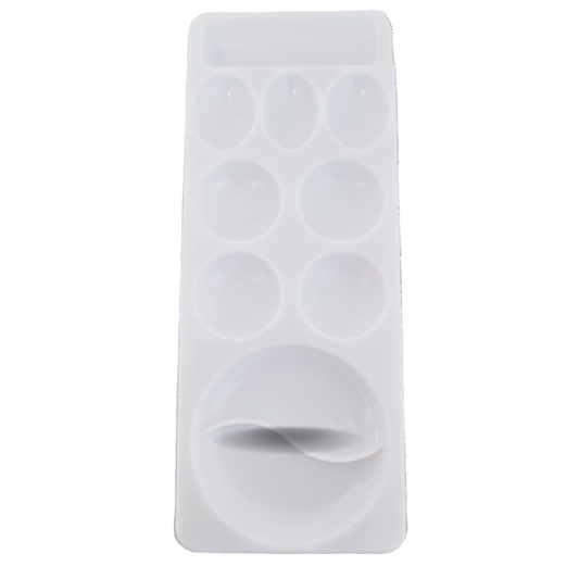 Silicone mixing tray circular cavities on a marble surface