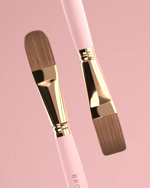 Brow Daddy Framework Master Brush, available in 2 options, for precise application in brow makeup and microblading, displayed on a clean, pink background , brush aside a bo
