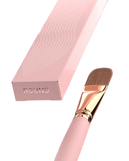 Brow Daddy Framework Master Brush, available in 2 options, for precise application in brow makeup and microblading, displayed on a clean, pink background , brush aside a bo