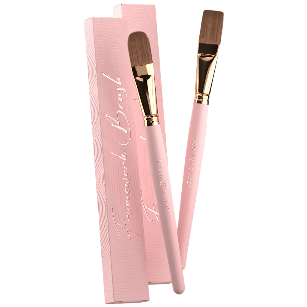 Brow Daddy Framework Master Brush, available in 2 options, for precise application in brow makeup and microblading, displayed on a clean, pink background , brush aside a box